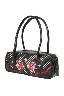 Détail face avant sac bowling noir à pois blancs, liseré rouge et fermeture éclair argentée, style rockabilly vintage